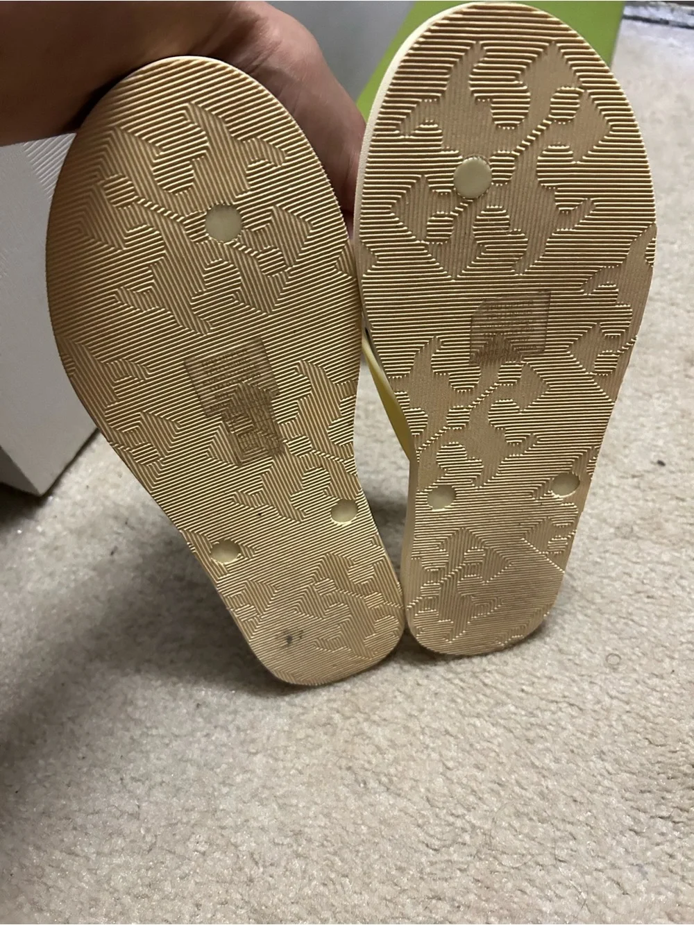 TORY BURCH KIRA padded flip flops in light yellow.